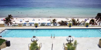 Refreshing outdoor pool with ocean view at The Atlantic Hotel & Spa.