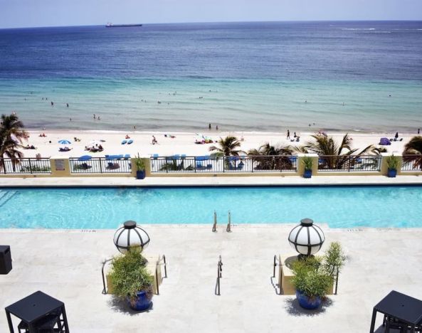 Refreshing outdoor pool with ocean view at The Atlantic Hotel & Spa.