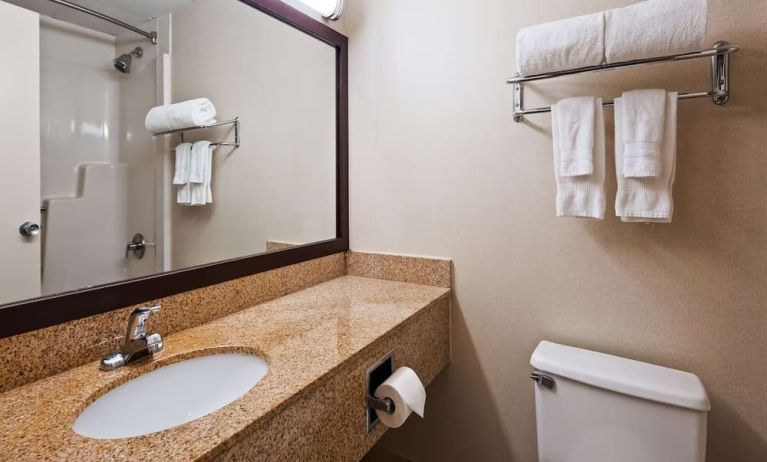 Guest bathroom with shower at Best Western Executive Hotel Of New Haven-West Haven.