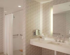 Guest bathroom with shower at Hyatt Regency Los Angeles International Airport.