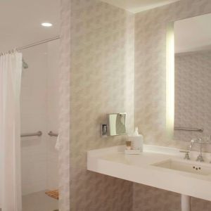 Guest bathroom with shower at Hyatt Regency Los Angeles International Airport.