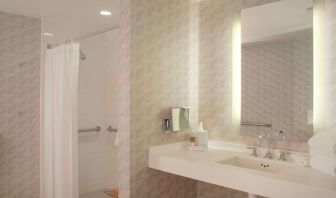 Guest bathroom with shower at Hyatt Regency Los Angeles International Airport.