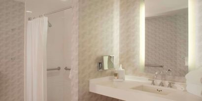 Guest bathroom with shower at Hyatt Regency Los Angeles International Airport.