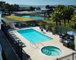 Refreshing outdoor pool and spa tub at The Marina Inn On San Francisco Bay.