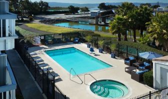 Refreshing outdoor pool and spa tub at The Marina Inn On San Francisco Bay.