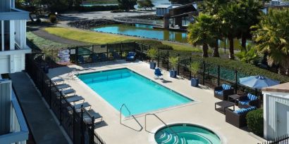 Refreshing outdoor pool and spa tub at The Marina Inn On San Francisco Bay.