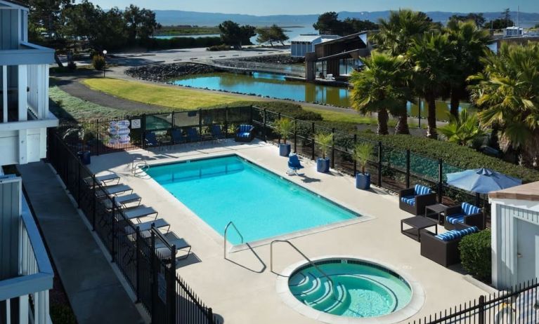 Refreshing outdoor pool and spa tub at The Marina Inn On San Francisco Bay.