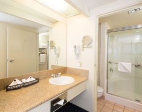 Guest bathroom with shower at The Marina Inn On San Francisco Bay.