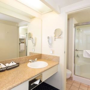 Guest bathroom with shower at The Marina Inn On San Francisco Bay.