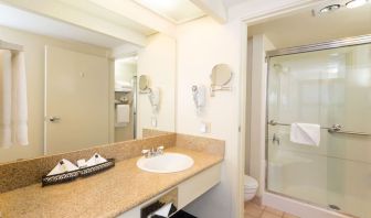 Guest bathroom with shower at The Marina Inn On San Francisco Bay.