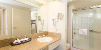 Guest bathroom with shower at The Marina Inn On San Francisco Bay.