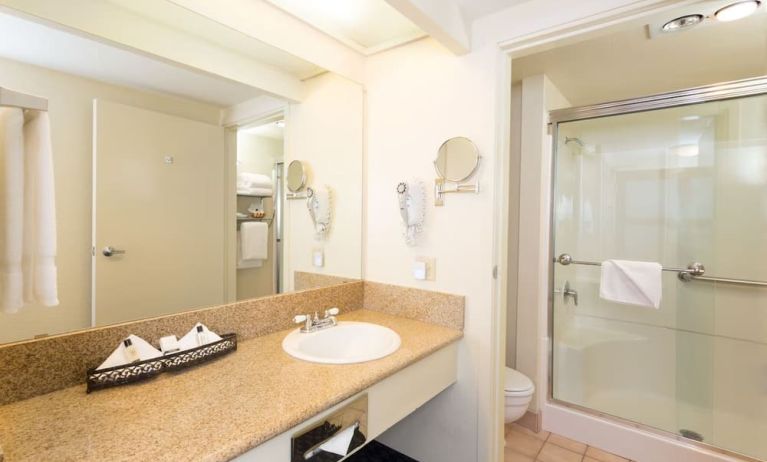 Guest bathroom with shower at The Marina Inn On San Francisco Bay.