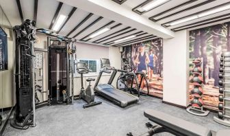 Fully equipped fitness center at Mercure Hotel London Hyde Park.