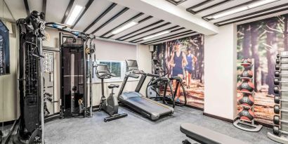 Fully equipped fitness center at Mercure Hotel London Hyde Park.