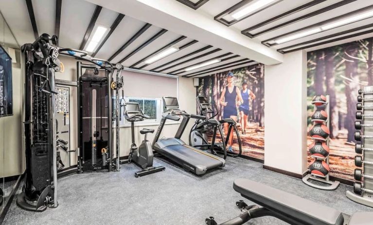 Fully equipped fitness center at Mercure Hotel London Hyde Park.