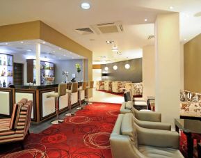 Bar lounge with comfortable seating at Mercure London Bloomsbury.