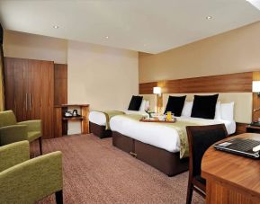 Day use twin room with work desk and lounge seating at Mercure London Bloomsbury.