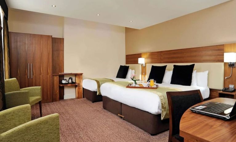 Day use twin room with work desk and lounge seating at Mercure London Bloomsbury.