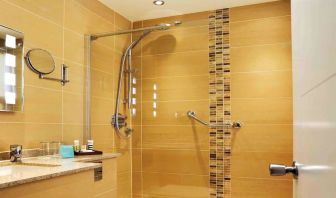 Guest bathroom with shower at Mercure London Bloomsbury.