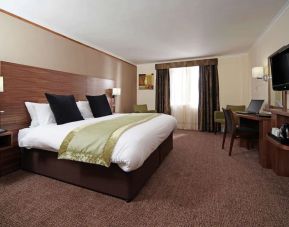 Day use room with TV screen, work desk and private bathroom at Mercure London Bloomsbury.