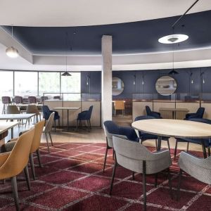 Dining area with comfortable seating, perfect for co-working at Hyatt Place London Heathrow Airport.