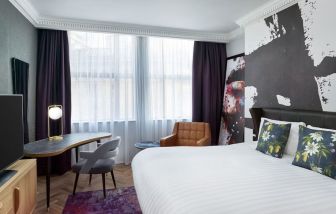 Bright and spacious king room with work desk at NYX Hotel London Holborn By Leonardo.