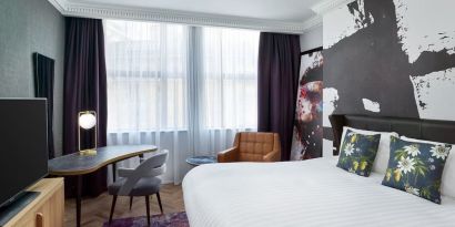 Bright and spacious king room with work desk at NYX Hotel London Holborn By Leonardo.