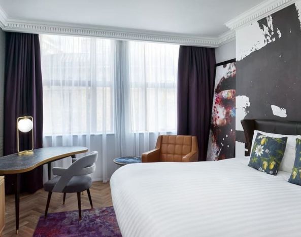 Bright and spacious king room with work desk at NYX Hotel London Holborn By Leonardo.