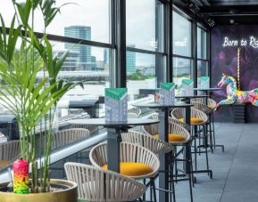 Rooftop terrace with lounge sitting at NYX Hotel London Holborn By Leonardo.