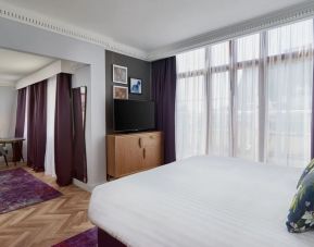 Day use studio suite with work desk and living area at NYX Hotel London Holborn By Leonardo.