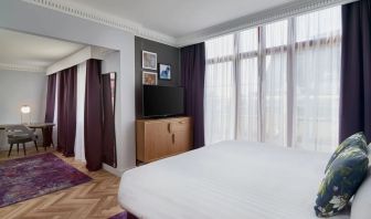 Day use studio suite with work desk and living area at NYX Hotel London Holborn By Leonardo.