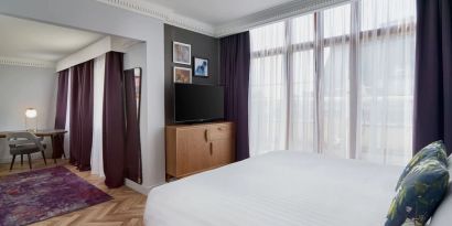 Day use studio suite with work desk and living area at NYX Hotel London Holborn By Leonardo.