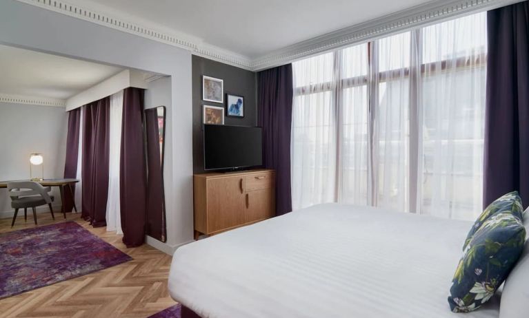 Day use studio suite with work desk and living area at NYX Hotel London Holborn By Leonardo.