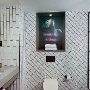 Guest bathroom with shower at NYX Hotel London Holborn By Leonardo.