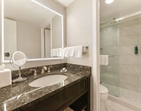 Guest bathroom with shower at Capital Hilton.