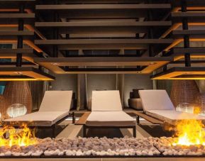 Lounge chairs and fire pit at Keight Hotel Opatija.