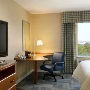 King room with TV at Hampton Inn New York - LaGuardia Airport.