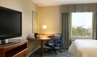 King room with TV at Hampton Inn New York - LaGuardia Airport.