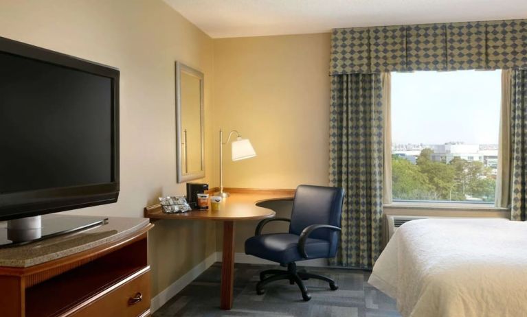 King room with TV at Hampton Inn New York - LaGuardia Airport.