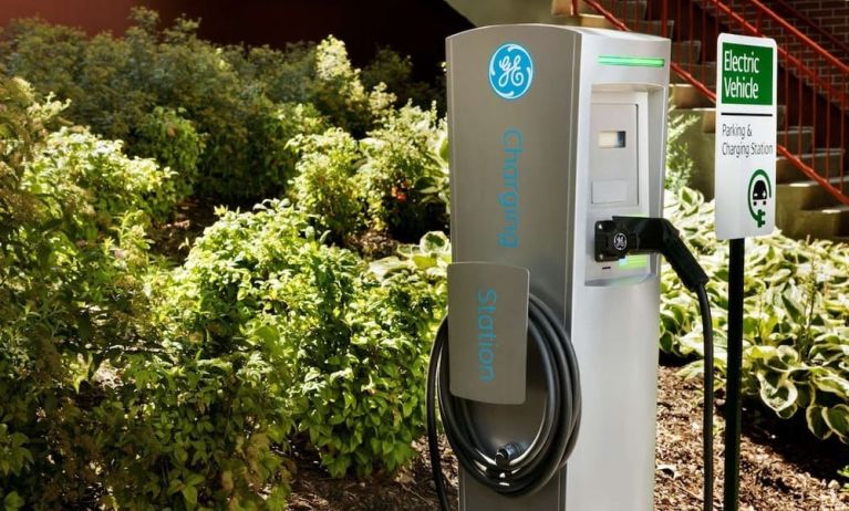 Car charging station and parking at Hampton Inn New York - LaGuardia Airport.