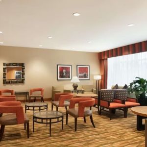 Lounge seating at Hampton Inn New York - LaGuardia Airport.