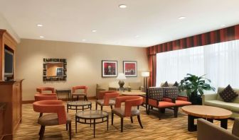 Lounge seating at Hampton Inn New York - LaGuardia Airport.