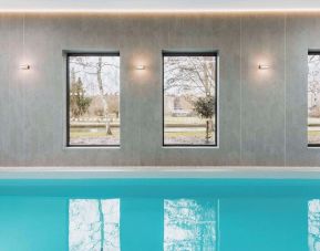 Indoor pool area at Graduate By Hilton Cambridge.