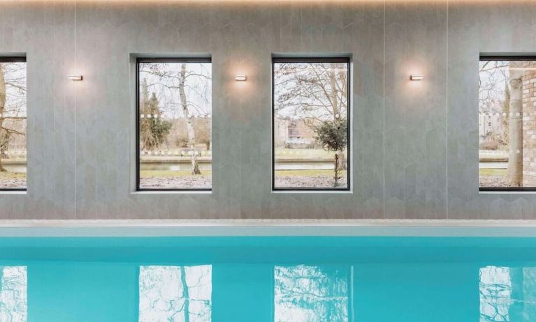 Indoor pool area at Graduate By Hilton Cambridge.