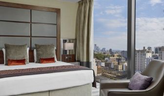 Day use room with floor to ceiling window at Leonardo Royal Hotel London Tower Bridge.