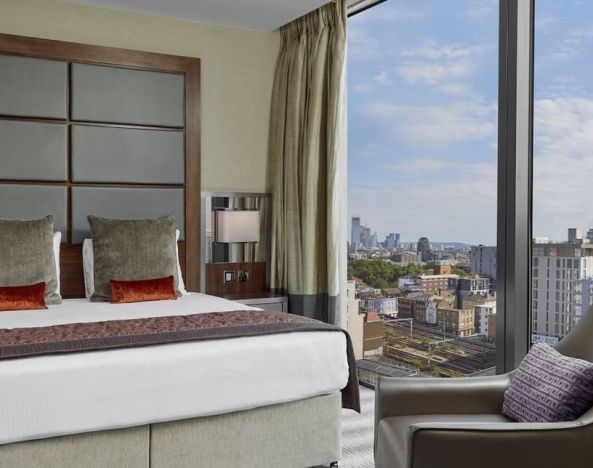 Day use room with floor to ceiling window at Leonardo Royal Hotel London Tower Bridge.