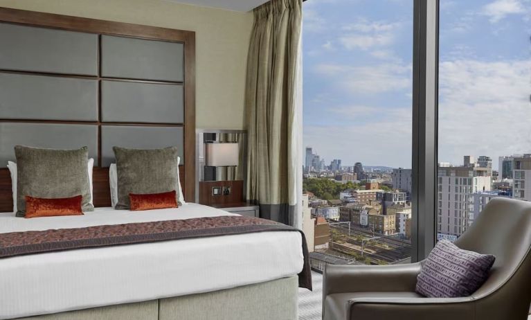 Day use room with floor to ceiling window at Leonardo Royal Hotel London Tower Bridge.