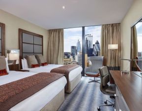 Day use twin room with work desk at Leonardo Royal Hotel London Tower Bridge.