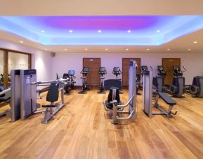 Fully equipped fitness center at Leonardo Royal Hotel London Tower Bridge.