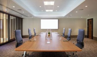 Professional meeting room with ergonomic chairs at Leonardo Royal Hotel London Tower Bridge.